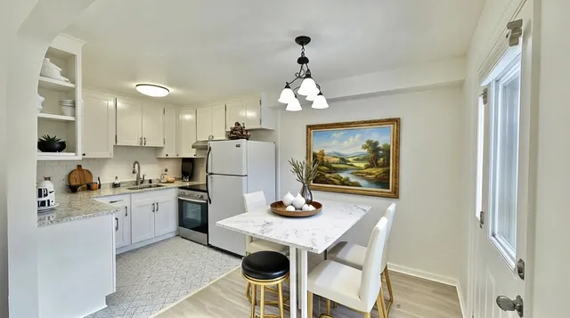 a kitchen with a refrigerator a sink and dishwasher