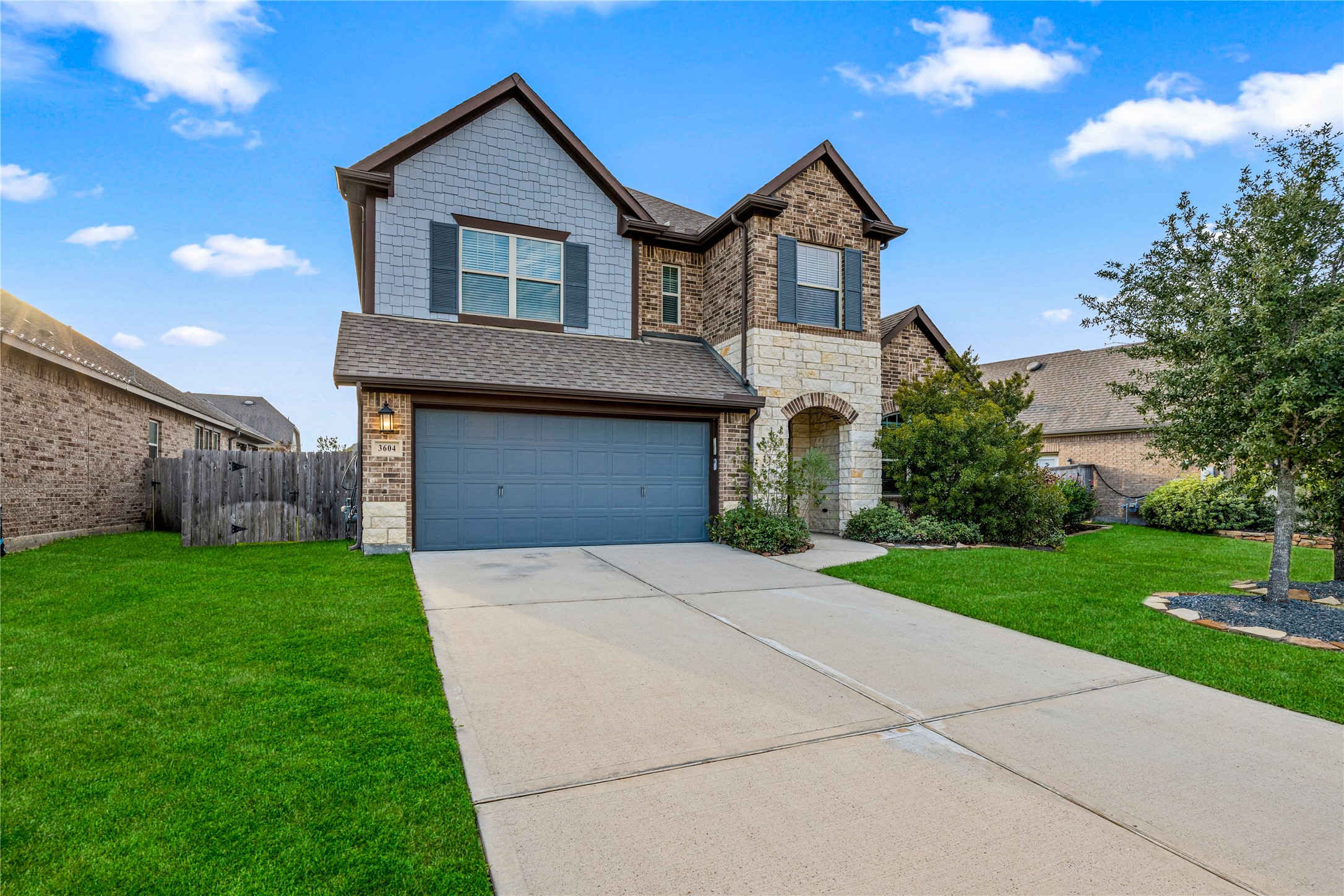 3604 Magnolia Crest Lane Spring, TX 77386 - Photo 2 of 50 a front view of a house with a yard and garage