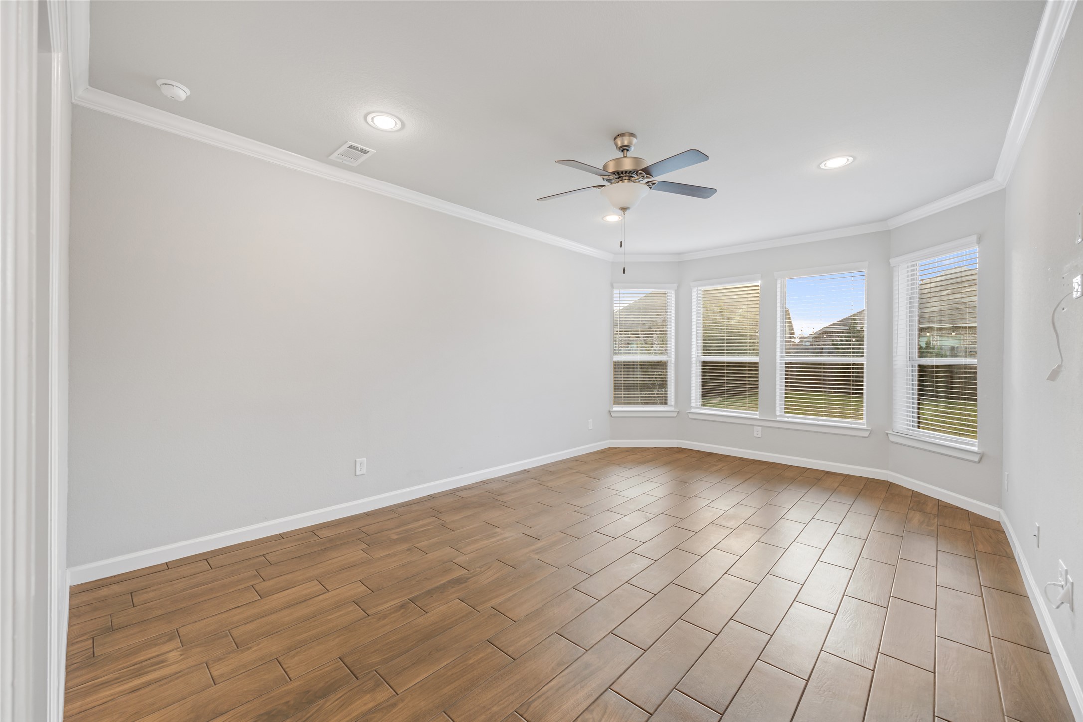 3604 Magnolia Crest Lane Spring, TX 77386 - Photo 25 of 50 a view of an empty room with a window and a kitchen