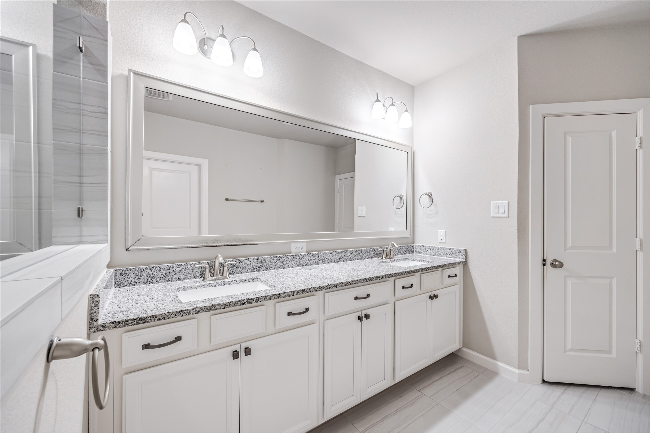3604 Magnolia Crest Lane Spring, TX 77386 - Photo 30 of 50 a bathroom with a granite countertop sink and a mirror