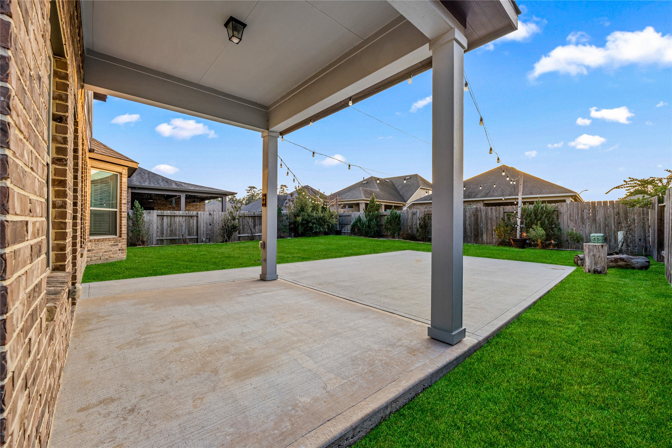 3604 Magnolia Crest Lane Spring, TX 77386 - Photo 44 of 50 a yellow and red tree in front of a brick house with a yard