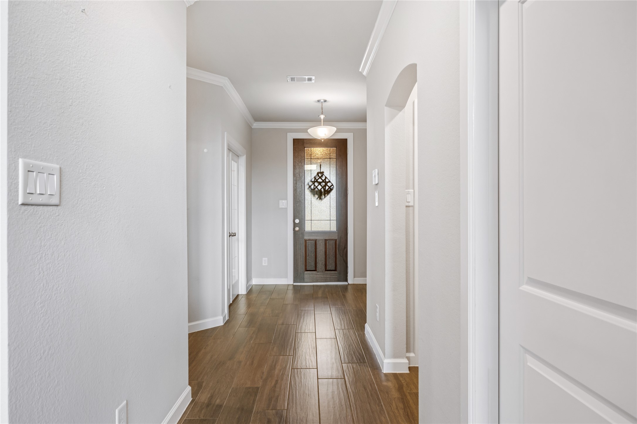 3604 Magnolia Crest Lane Spring, TX 77386 - Photo 6 of 50 a view of a hallway with wooden floor and staircase