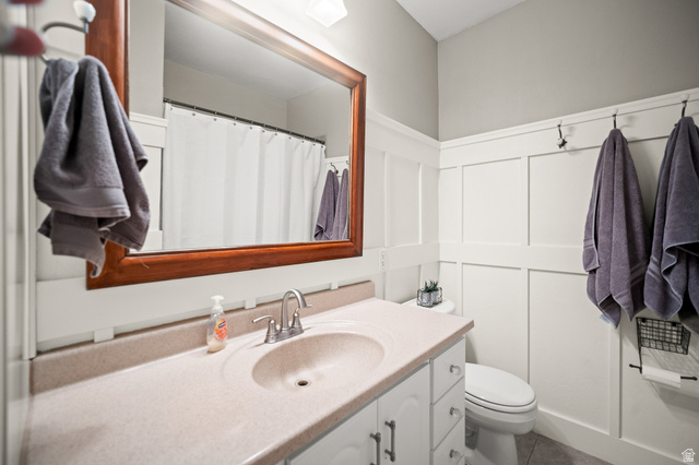 236 West 300 South Hurricane, UT 84737 - Photo 25 of 76 Bathroom vanity with integrated sink, chrome faucet, and expansive wood-framed mirror