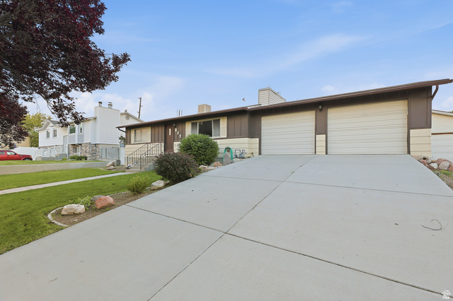 822 Pinewood Circle Price, UT 84501 - Photo 43 of 49 Ranch-style exterior with a dual garage featuring two white garage doors