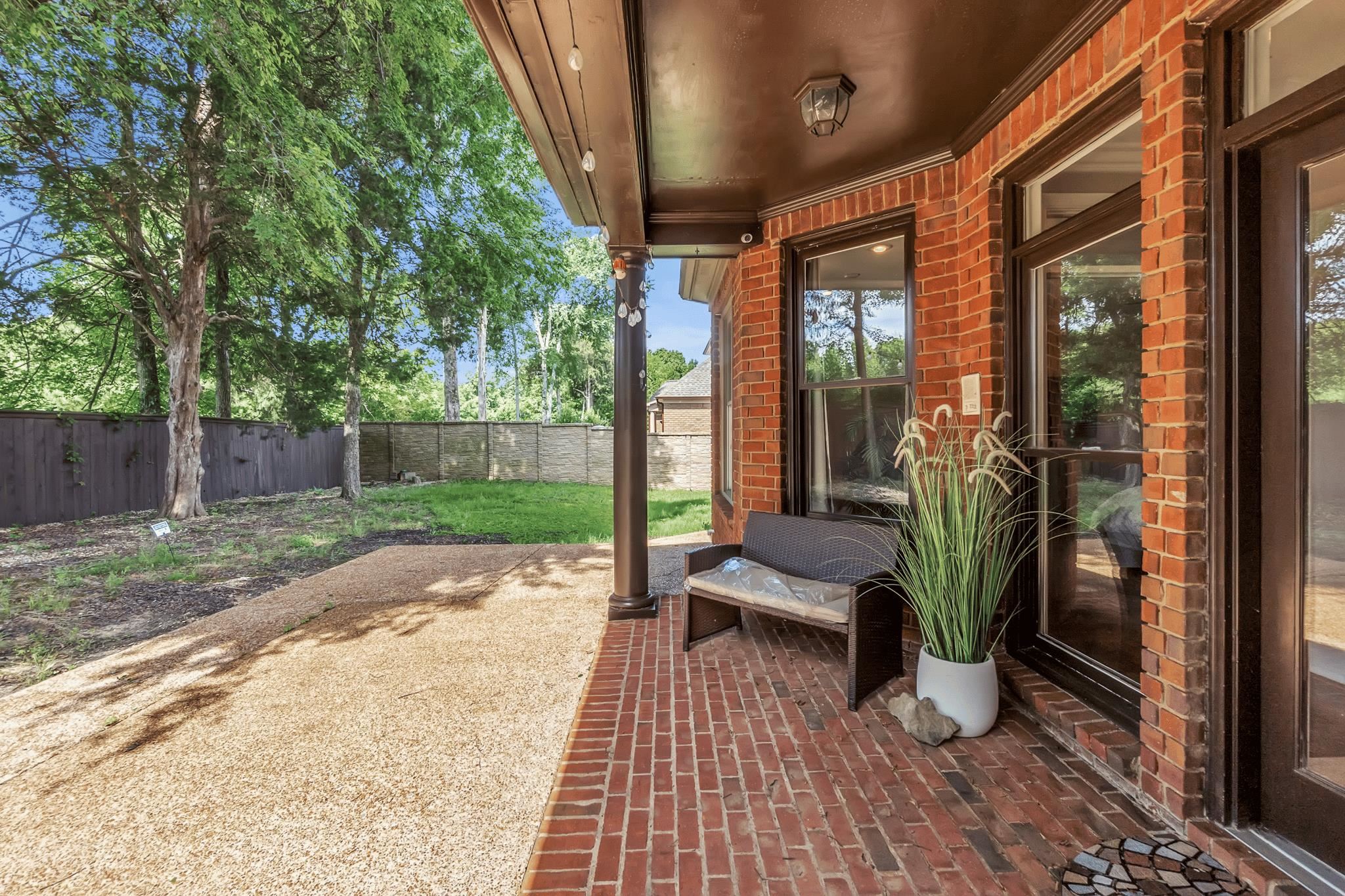 649 Ridge Springs Road Collierville, TN 38017 - Photo 7 of 38 Covered patio with brick flooring, brick exterior, and dark-framed windows