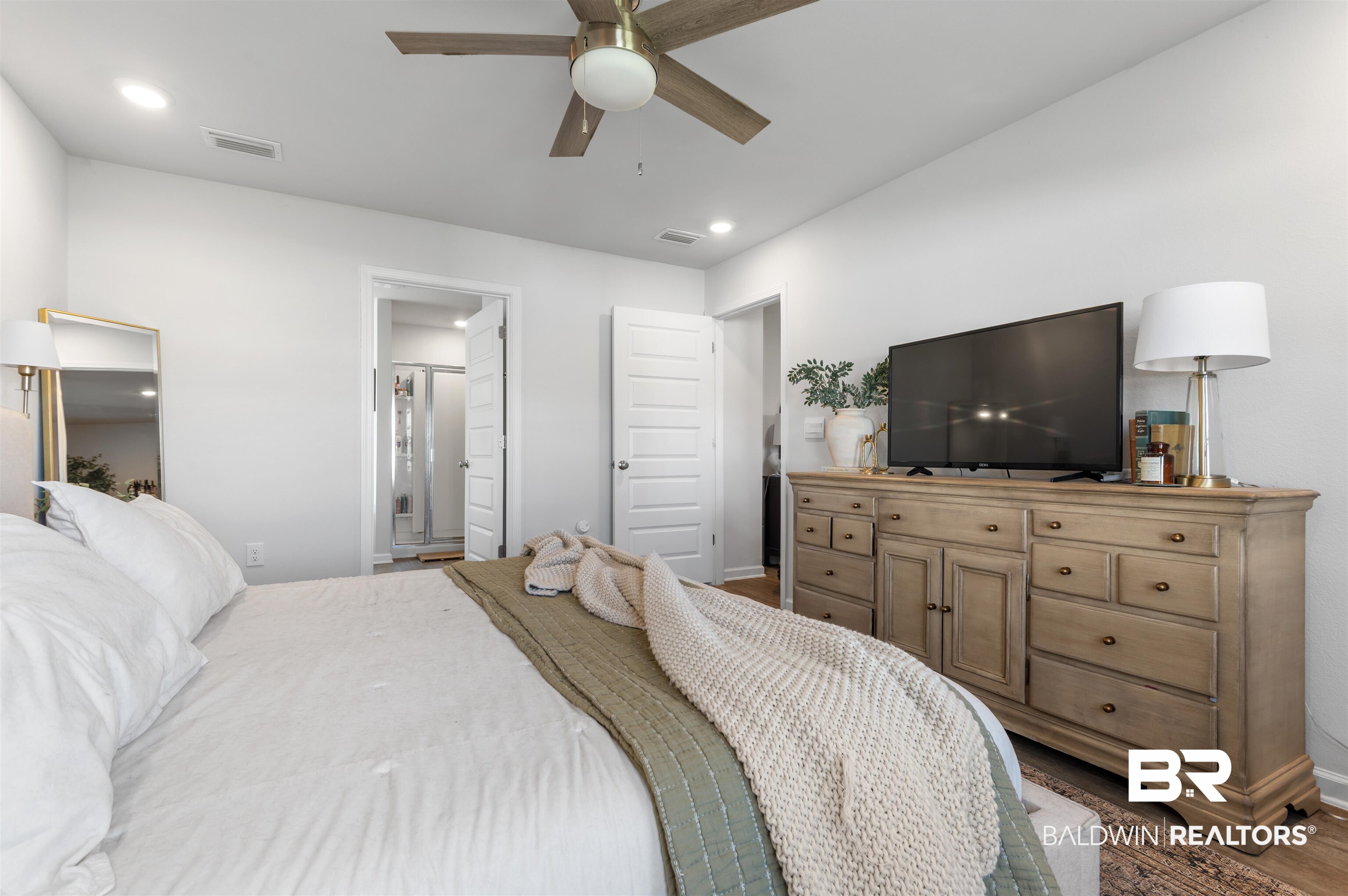 23544 Unbridled Loop Daphne, AL 36526 - Photo 13 of 25 Bedroom featuring a vaulted ceiling with a ceiling fan, recessed lighting, and a modern wood-finish dresser