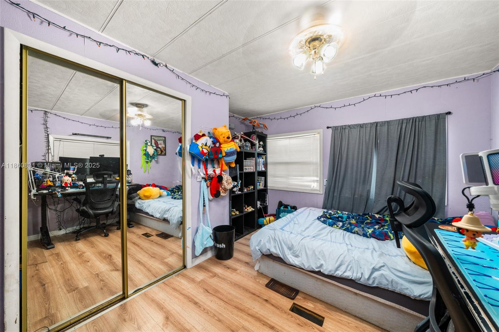 3208 Delaware Avenue Sebring, FL 33870 - Photo 13 of 37 a bed room with a bed and a window