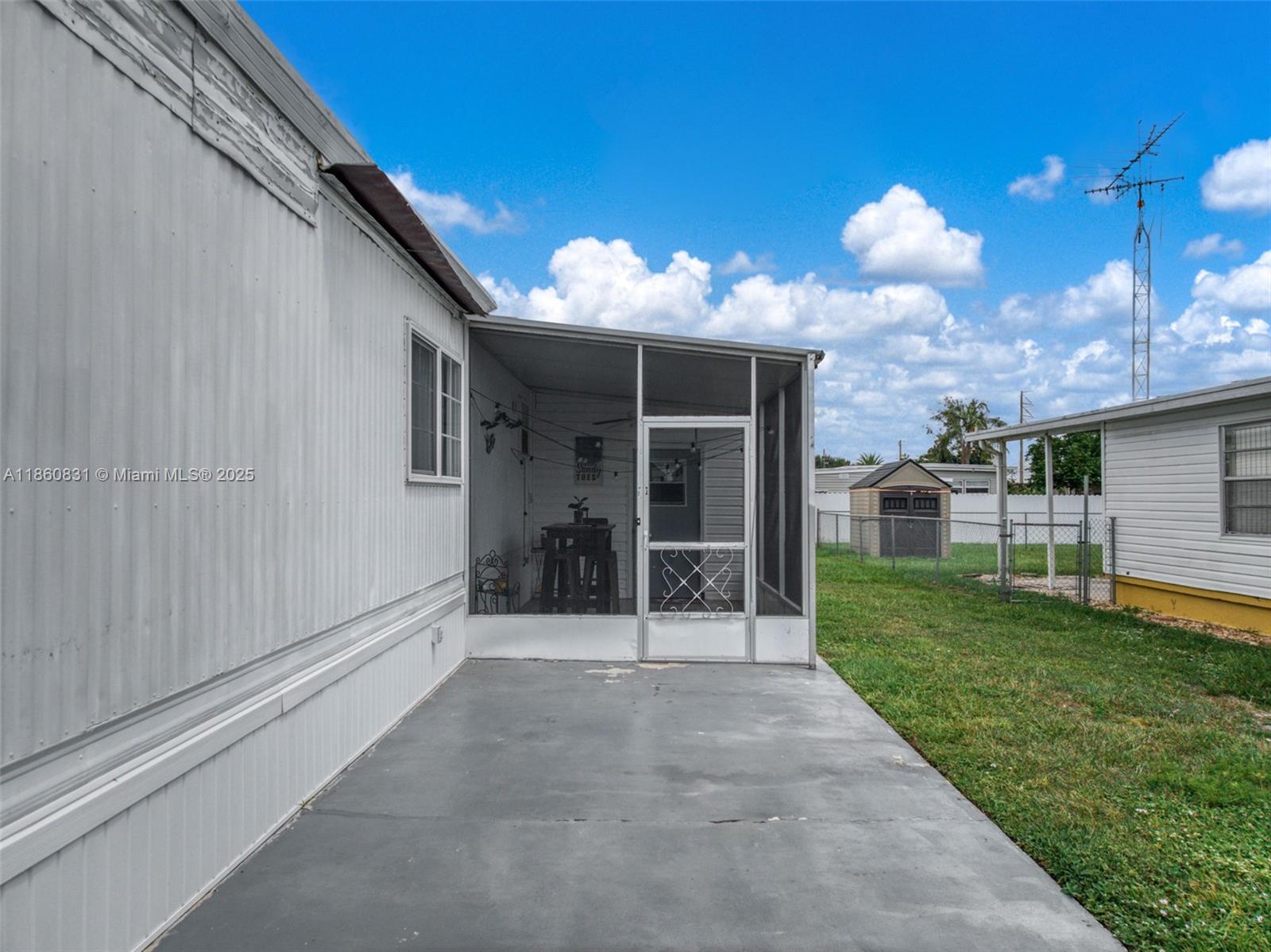 3208 Delaware Avenue Sebring, FL 33870 - Photo 2 of 37 a view of a house with a yard and porch