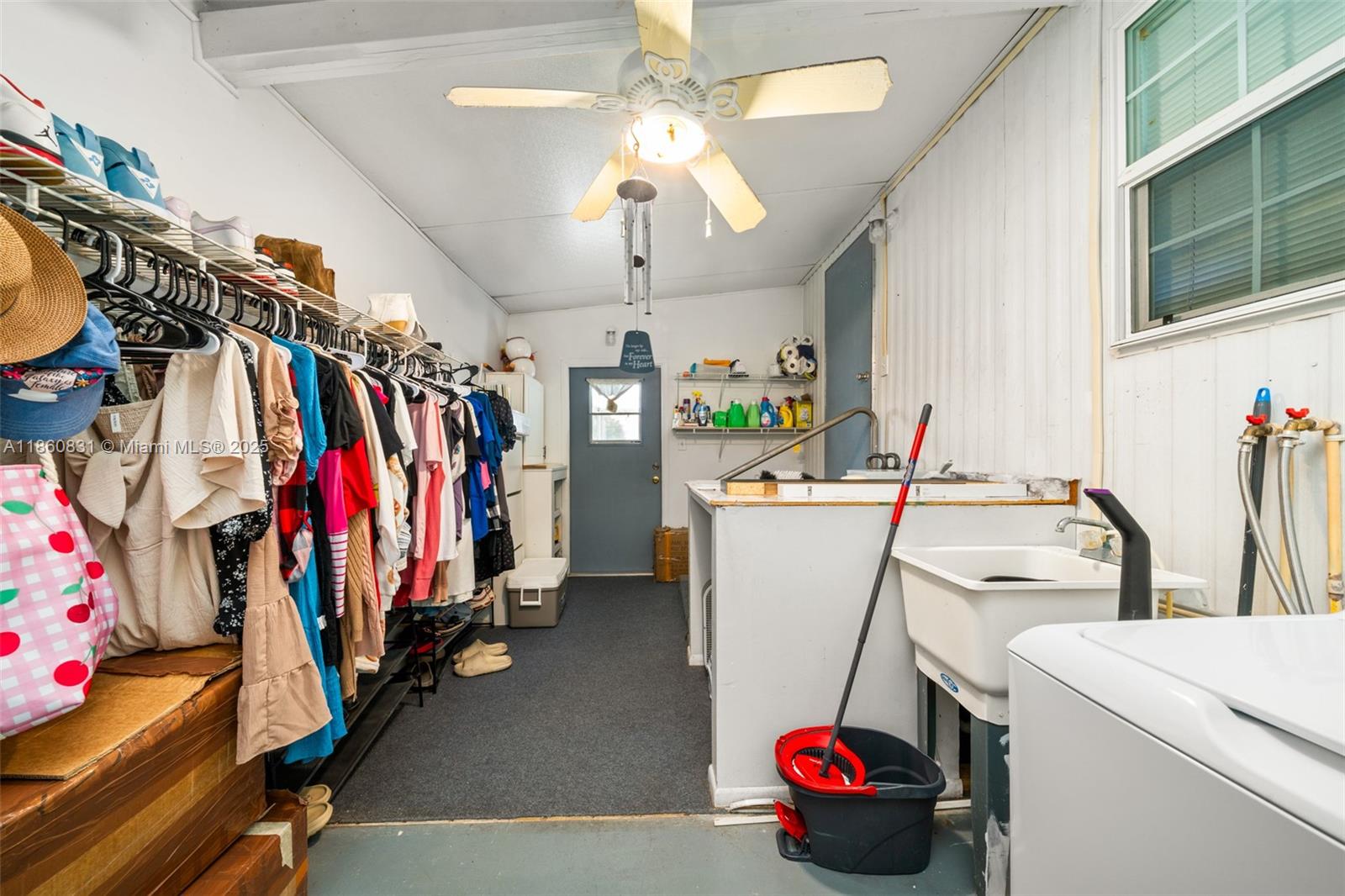3208 Delaware Avenue Sebring, FL 33870 - Photo 21 of 37 a view of walk in closet with clothes and shoes