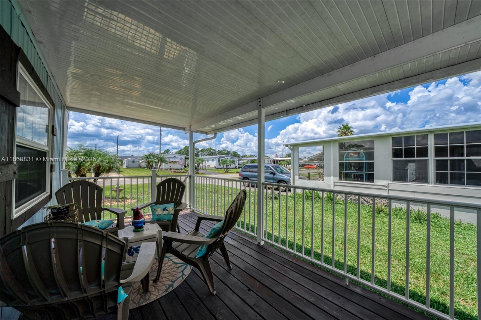 3208 Delaware Avenue Sebring, FL 33870 - Photo 23 of 37 a view of a chairs and table in patio with a barbeque grill