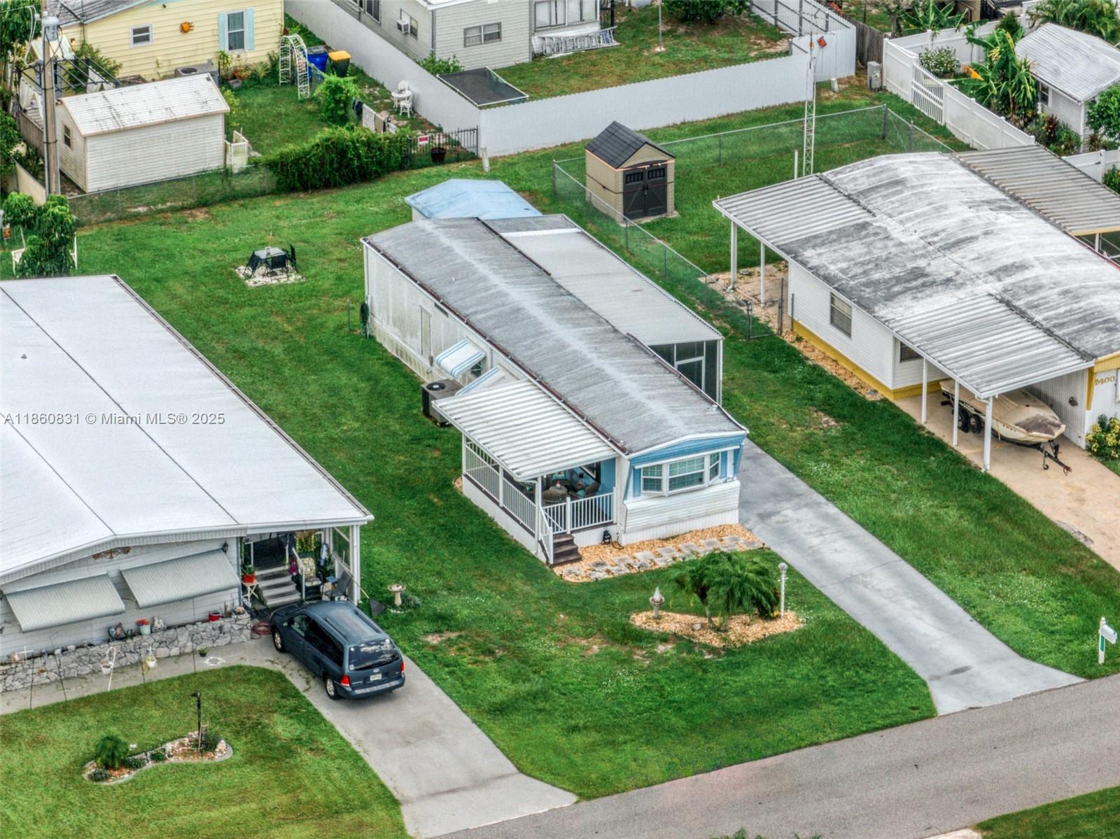 3208 Delaware Avenue Sebring, FL 33870 - Photo 29 of 37 an aerial view of a house with a yard table and chairs
