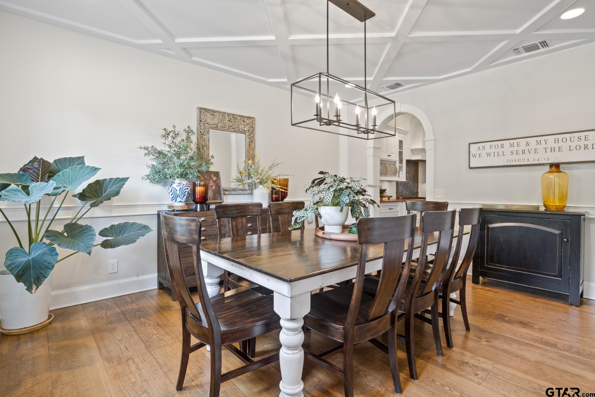 134 Private Road New Boston, TX 75570 - Photo 7 of 40 a view of a dining room with furniture wooden floor and chandelier