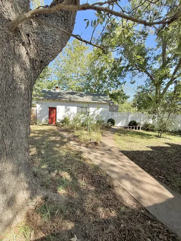 a front view of house with yard and entertaining space
