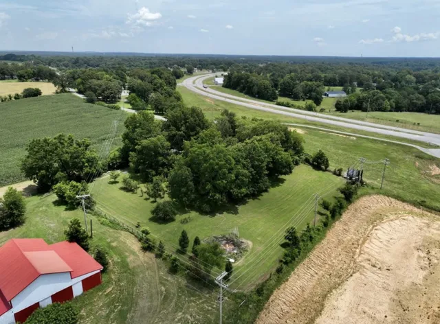 an aerial view of a houses with outdoor space and street view