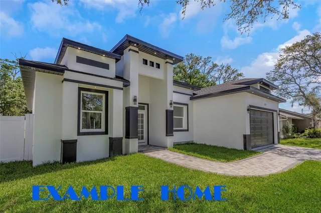 a view of an house with backyard space and balcony