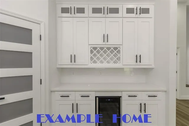 a kitchen with stainless steel appliances a stove a sink and a refrigerator