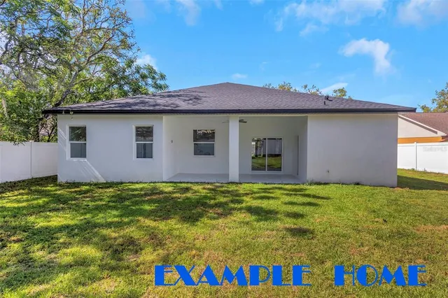 a view of street sign under a large tree
