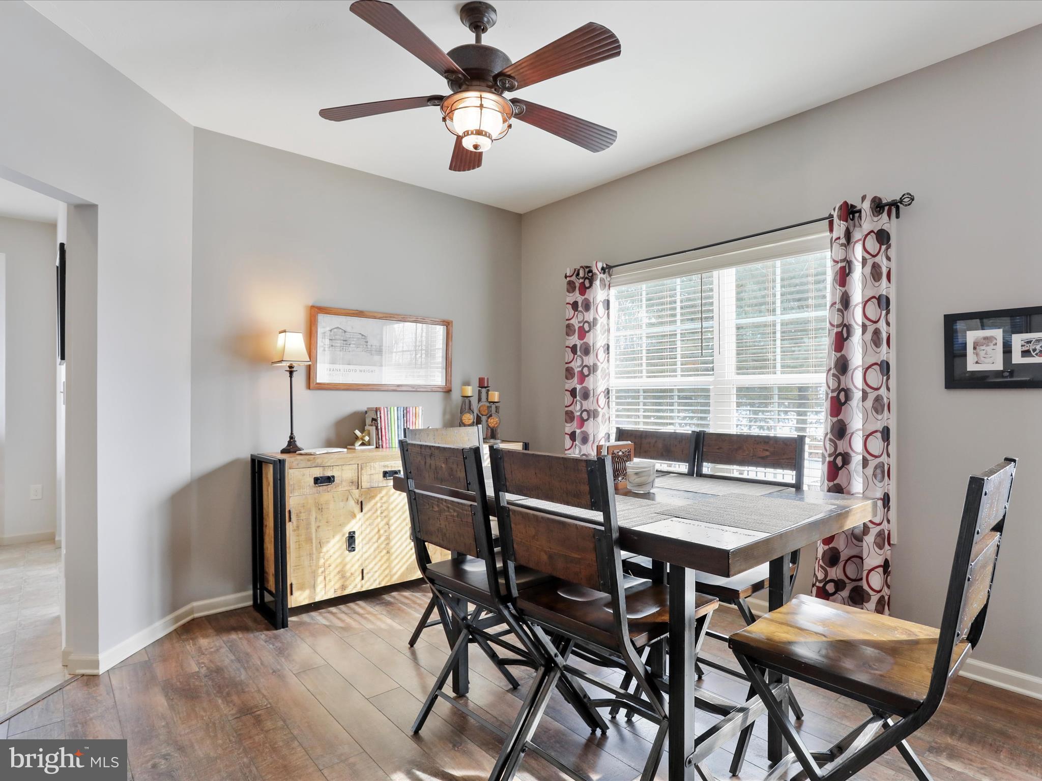 416 Castleton Drive Chambersburg, PA 17202 - Photo 12 of 51 a view of a dining room with furniture and a window