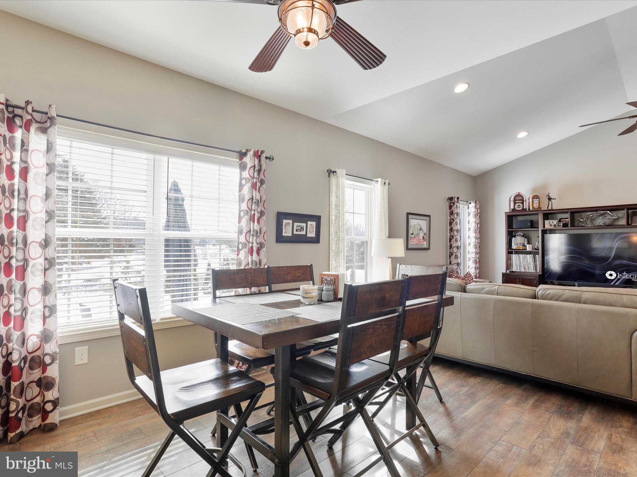 416 Castleton Drive Chambersburg, PA 17202 - Photo 14 of 51 a dining room with a wooden table and chairs