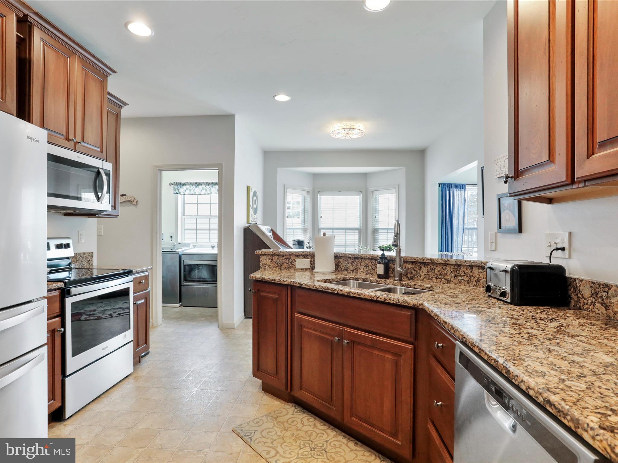 416 Castleton Drive Chambersburg, PA 17202 - Photo 20 of 51 a kitchen with granite countertop stainless steel appliances stove microwave and sink