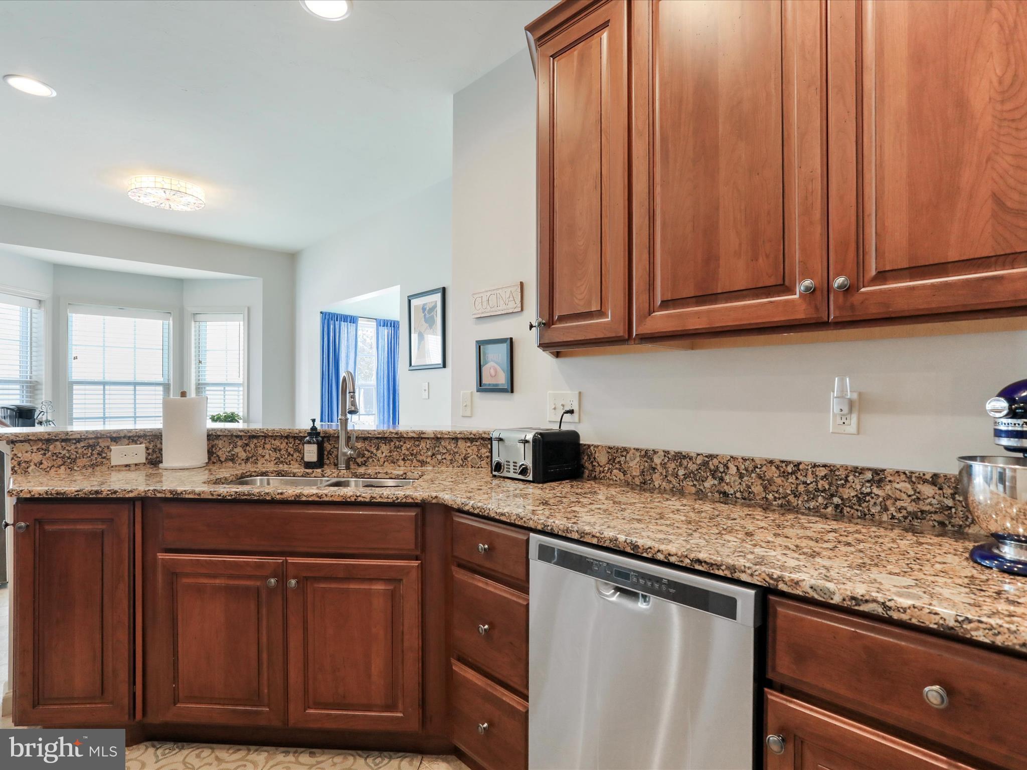 416 Castleton Drive Chambersburg, PA 17202 - Photo 21 of 51 a kitchen with granite countertop stainless steel appliances sink and cabinets