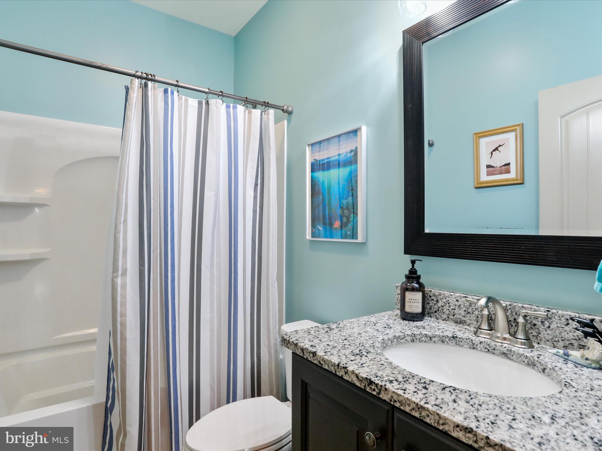 416 Castleton Drive Chambersburg, PA 17202 - Photo 31 of 51 a bathroom with a granite countertop sink and a mirror
