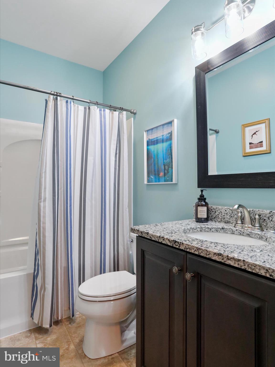 416 Castleton Drive Chambersburg, PA 17202 - Photo 32 of 51 a bathroom with a granite countertop sink toilet and mirror
