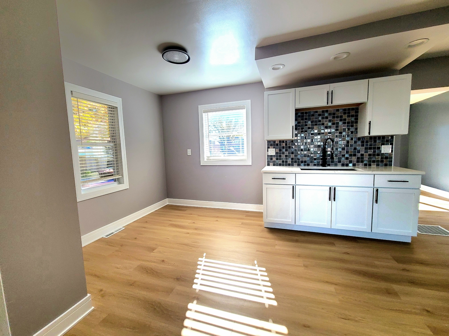 3801 West 63rd Place Chicago, IL 60629 - Photo 11 of 36 a kitchen with a stove and a wooden floor