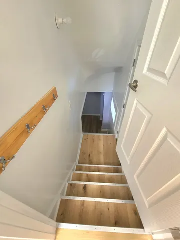 a view of entryway with wooden floor