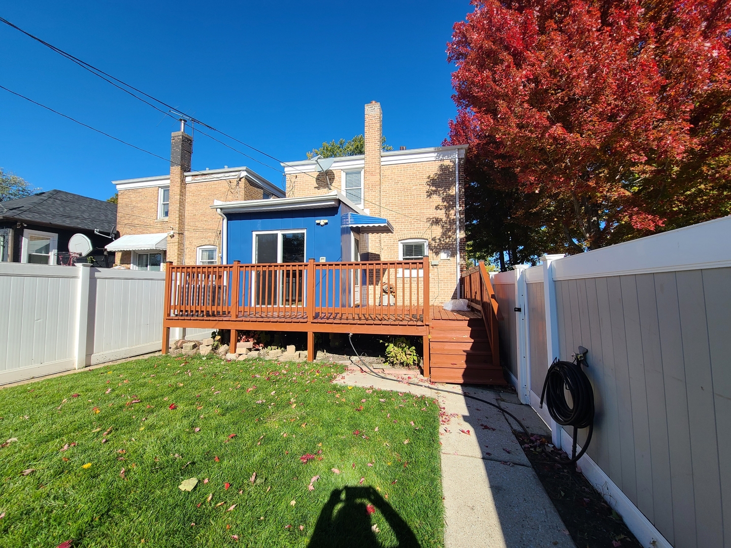 3801 West 63rd Place Chicago, IL 60629 - Photo 30 of 36 a view of a house with a small yard and sitting area
