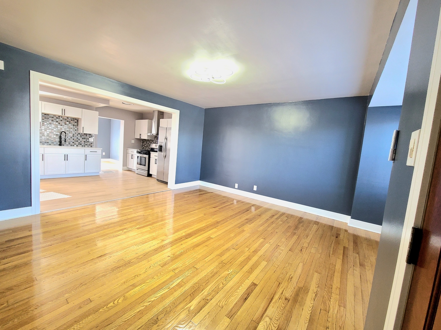 3801 West 63rd Place Chicago, IL 60629 - Photo 5 of 36 a view of empty room with wooden floor