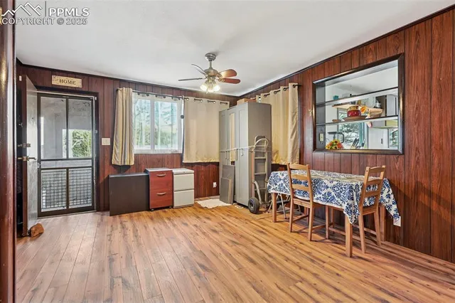 a room with wooden floors and furniture