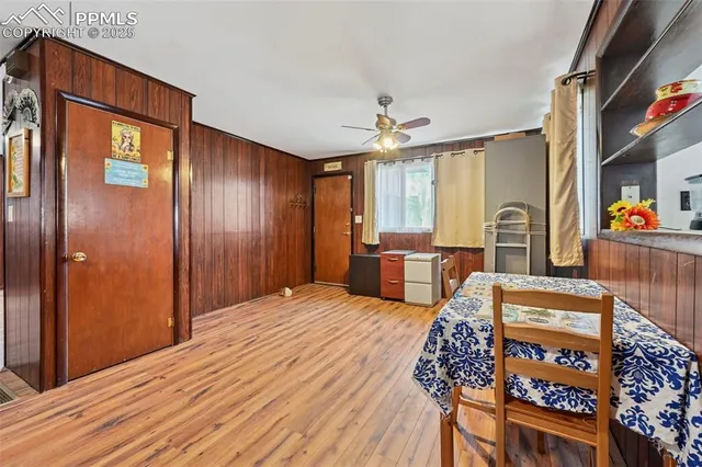 a bedroom with furniture and wooden floor