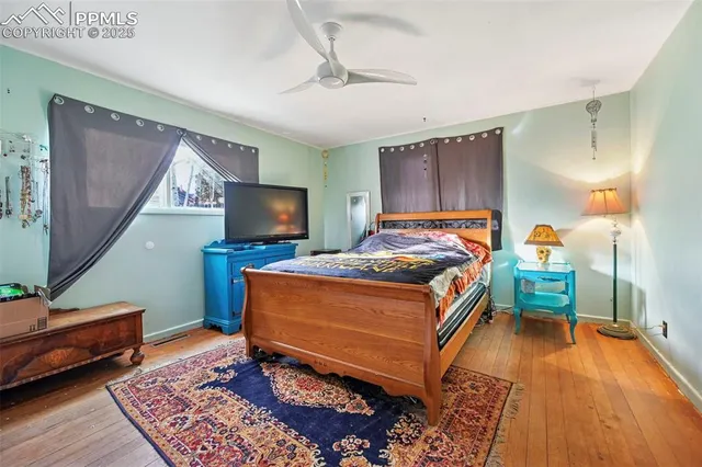 a room with a bed and a flat screen tv