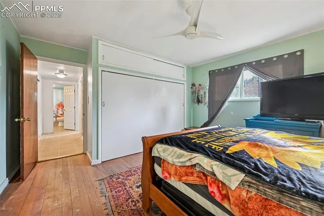 a bedroom with bed and a window