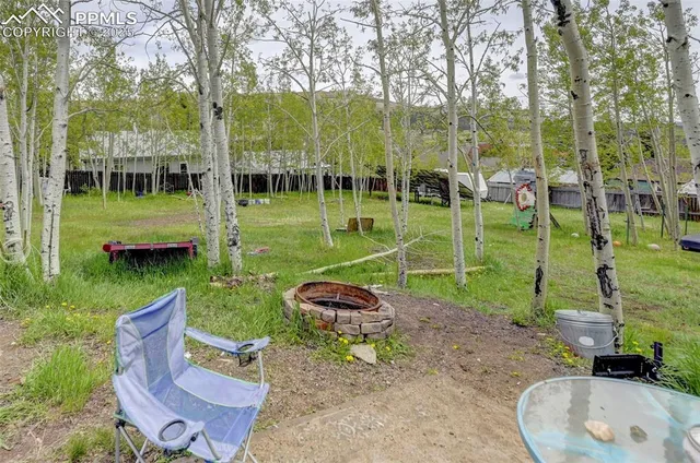 a childrens park with lots of swings and slides