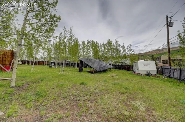 a view of outdoor space with playground and trees