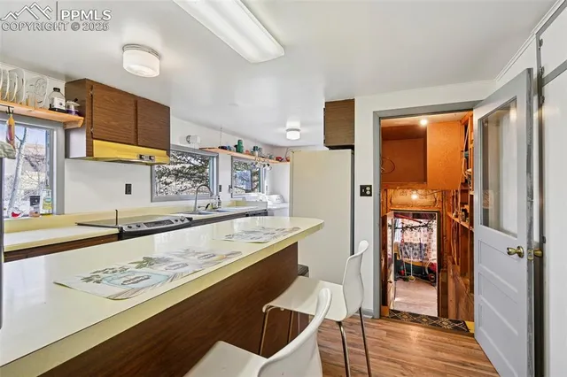 a kitchen with stainless steel appliances granite countertop a sink and cabinets