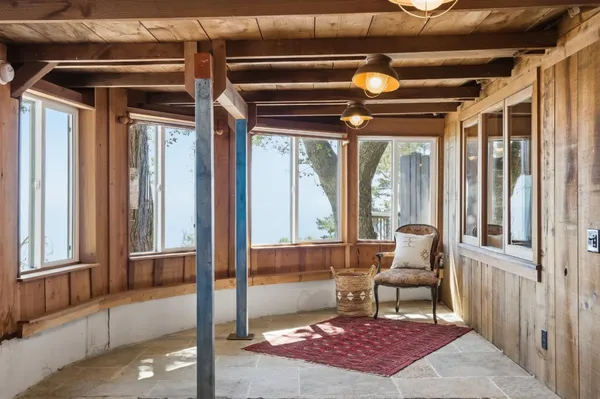 a chair and table in a balcony