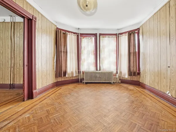 a view of a room with a large window