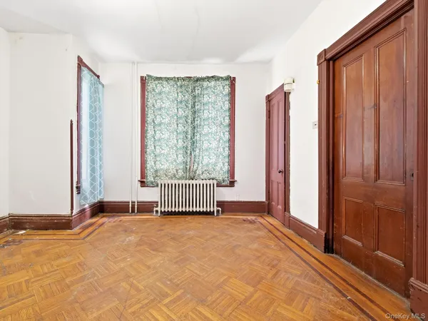 a view of a room with a large window