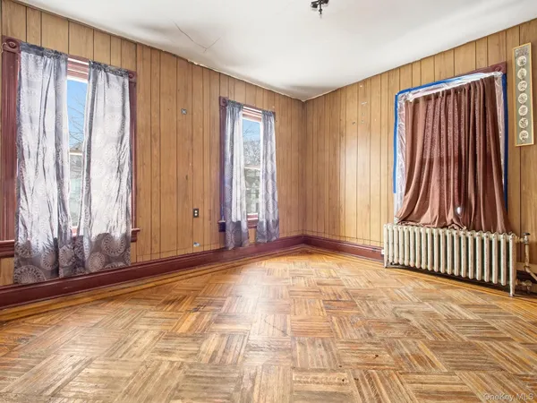 a view of a room with a window and a door