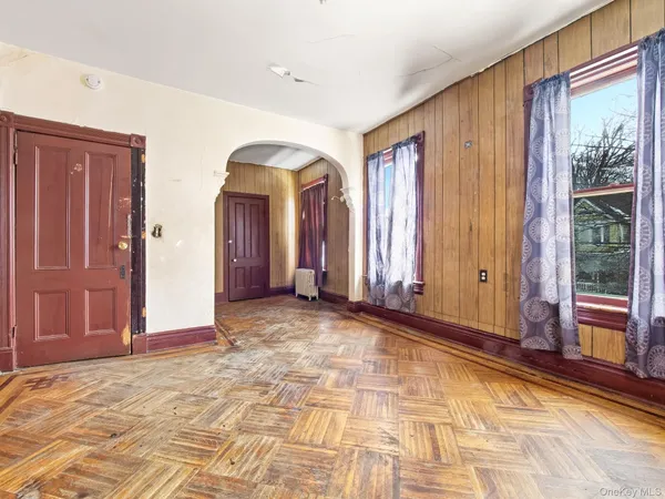 a view of a room with large windows