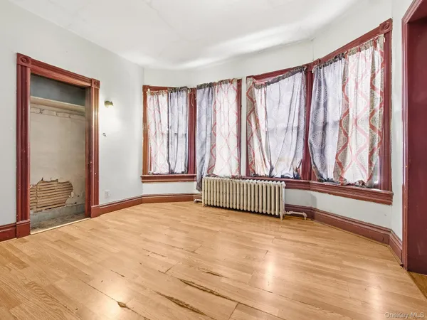 a view of a room with wooden floor and chair