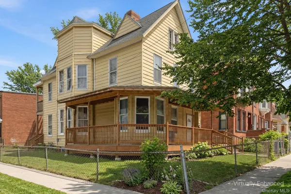 a view of a house with a street