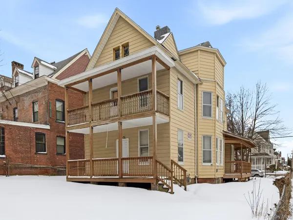 a view of a city street and a building