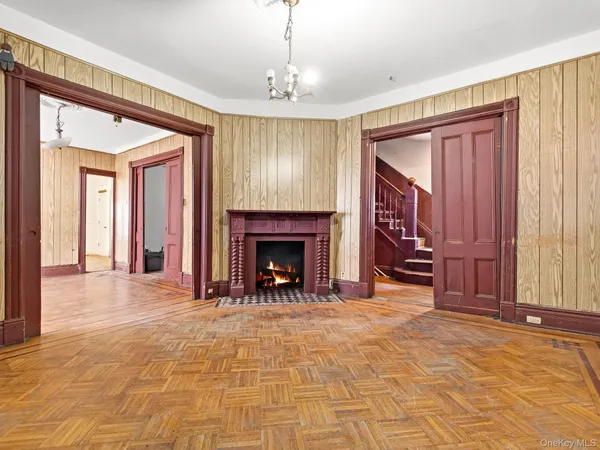 a view of a livingroom with fireplace and window
