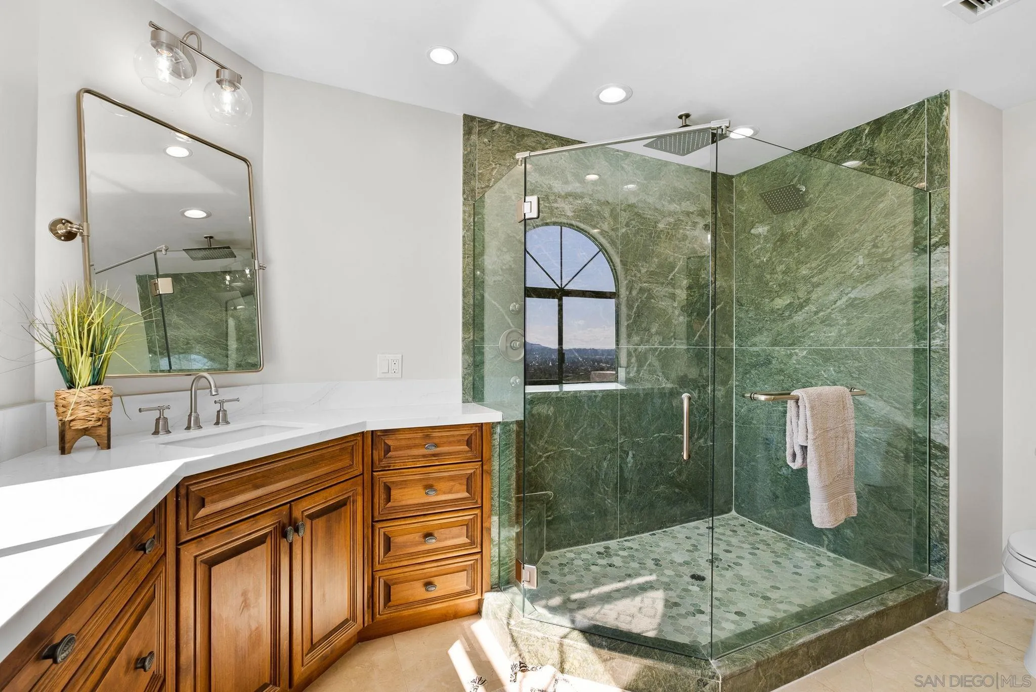 2044 Eula Lane El Cajon, CA 92019 - Photo 19 of 47 a bathroom with a sink a mirror and shower