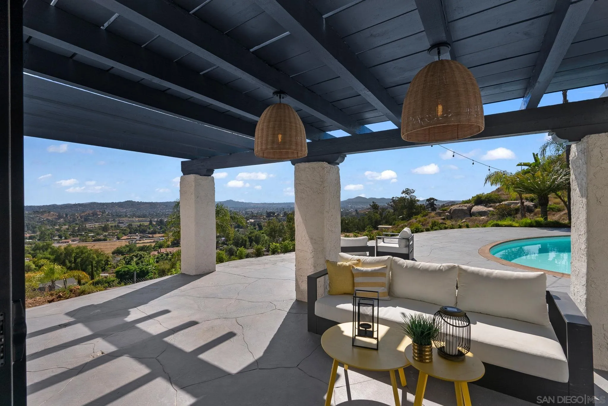 2044 Eula Lane El Cajon, CA 92019 - Photo 26 of 47 a view of a patio with a table chairs and a floor to ceiling window