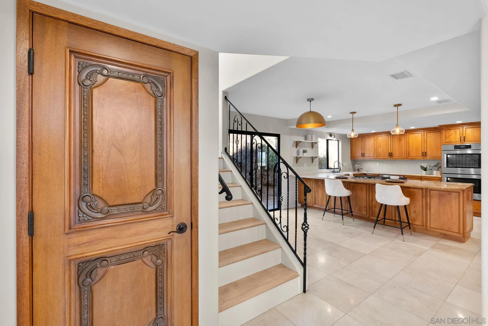 2044 Eula Lane El Cajon, CA 92019 - Photo 35 of 47 a view of a hallway with entryway wooden floor table and chairs